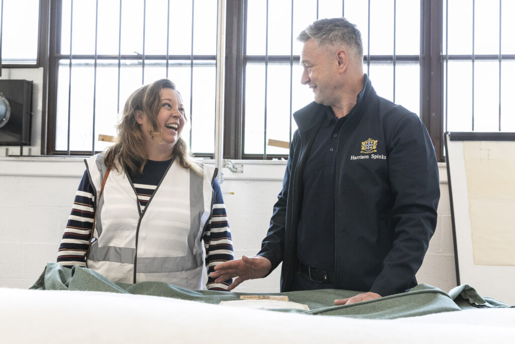 Abigail Reeve (Left) with Dean Wilkinson (Right) looking at the new fabric for the refurbished divan bed