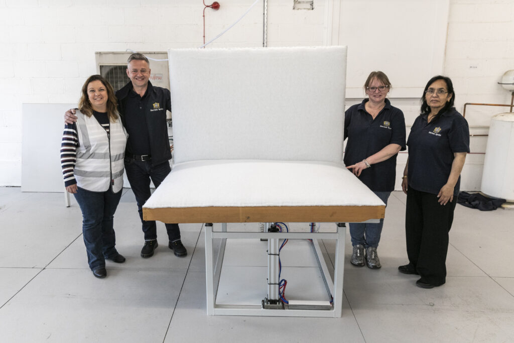 (L-R) Abigail Reeve with the Harrison Spinks team that refurbished her bed: Karen Firth, Lead Operative, Dean Wilkinson, Master Bedmaker, and Manjit Kaushal, Process Operative